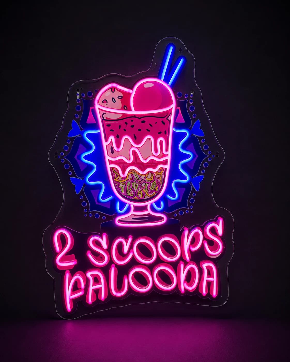Pink and blue dessert sign with an ice cream sundae and stylized lettering